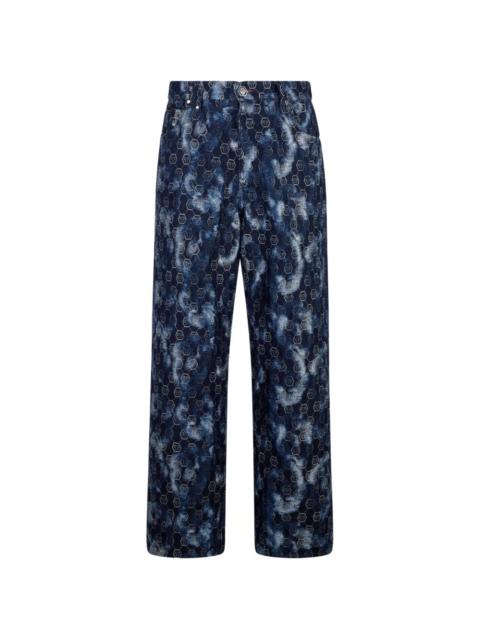 monogram-pattern denim jeans