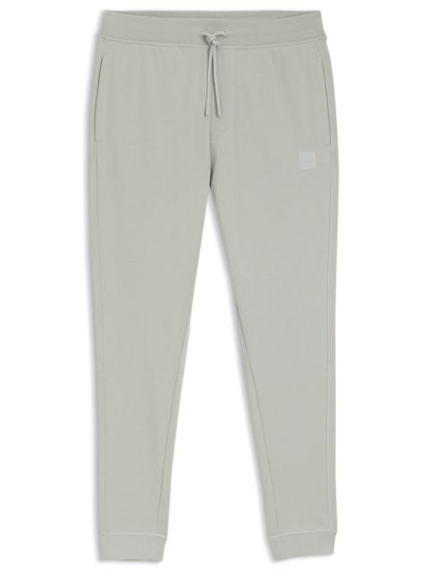 LOGO-PATCH TRACKSUIT BOTTOMS IN COTTON TERRY