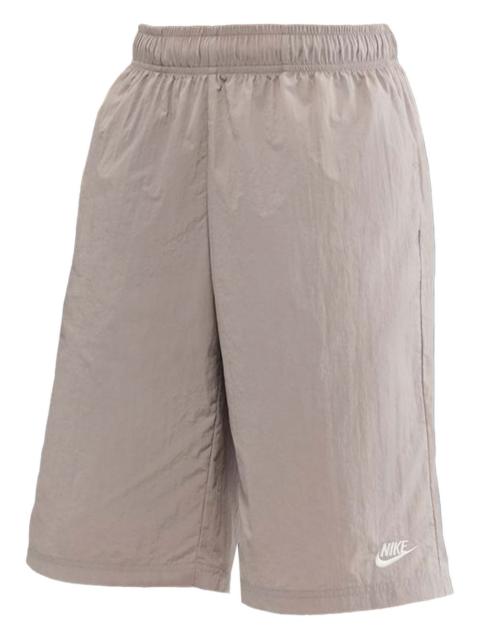 Swoosh-embroidered elastic-waist shorts