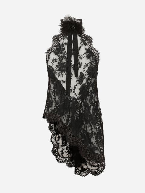 Asymmetrical lace top with flower detail on neck