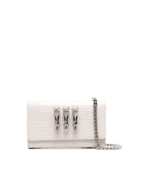 skull-charm crossbody clutch bag