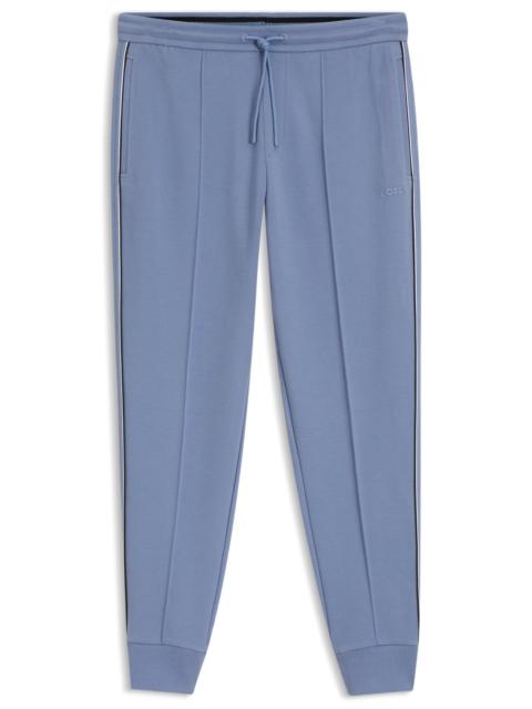 PIPING-DETAIL TRACKSUIT BOTTOMS IN A COTTON BLEND