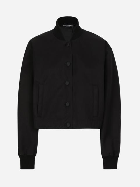 Gabardine bomber jacket, waxed on reverse, with branded tag