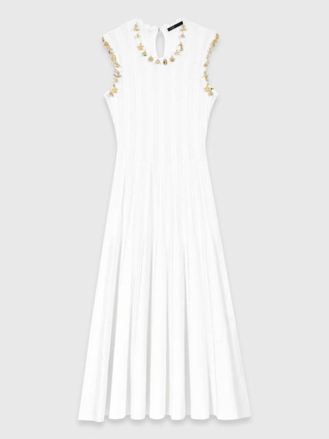 Knit dress with gold jewellery