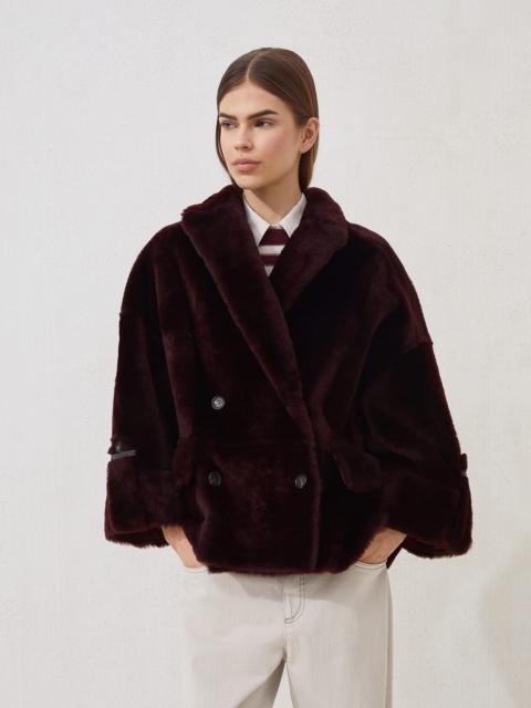 Reversible shearling outerwear jacket with shiny cuff details