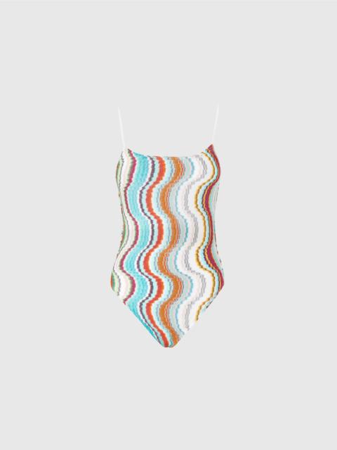 One-piece swimsuit with lamé wave pattern