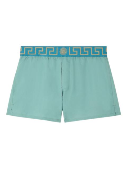 Greca-border swim trunks