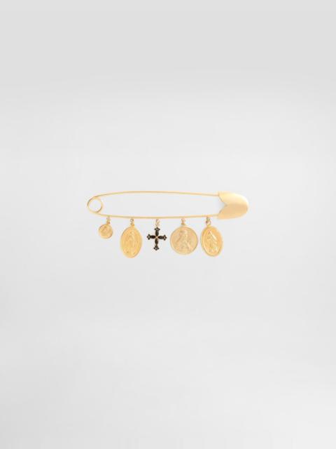 Safety brooch with cross and medals