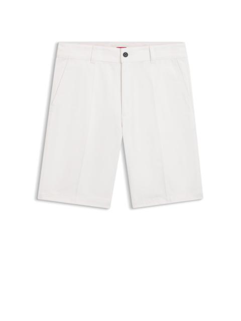 REGULAR-FIT SHORTS WITH SLIM LEG AND BUTTONED POCKETS