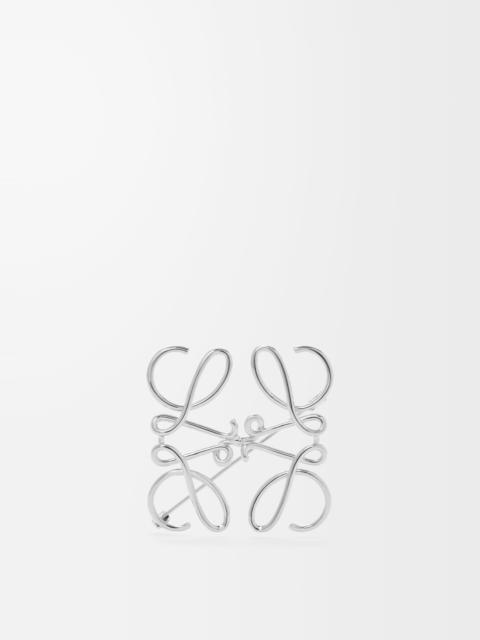 Anagram brooch in metal