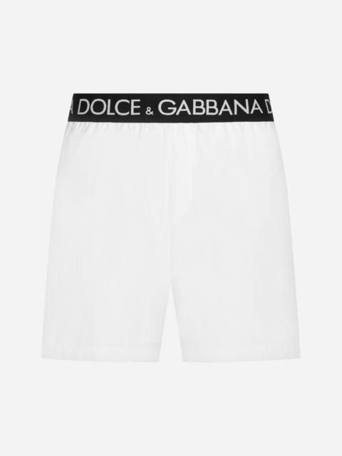 Mid-length swim trunks with branded stretch waistband
