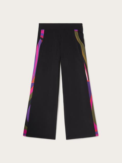 TROUSERS WITH PRINTED IRIDE DETAILS