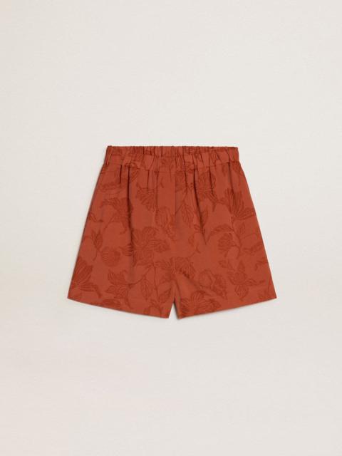 Women's shorts in brick-red jacquard with marine floral pattern