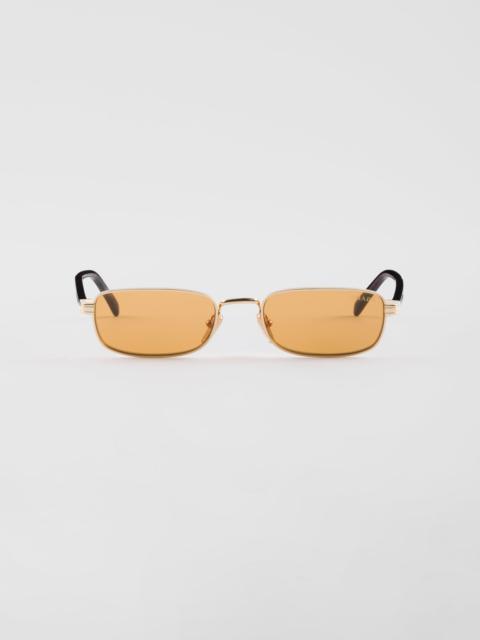 Sunglasses with the iconic metal plaque