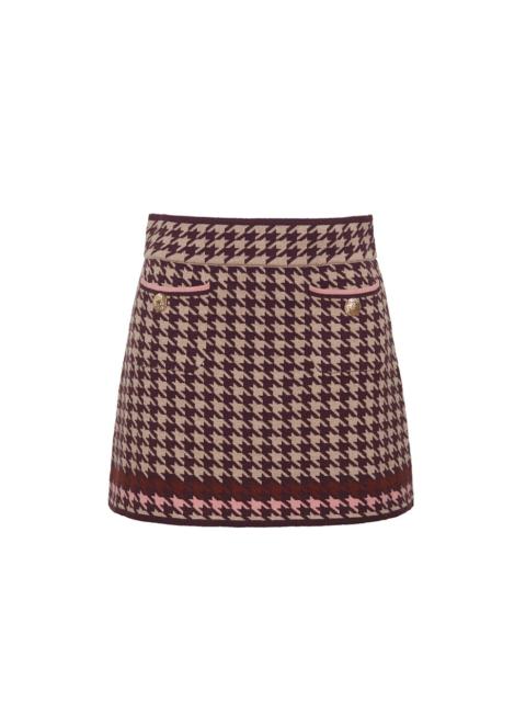 Lynne Mini Skirt
Timeless Houndstooth in a Tailored Mini Silhouette