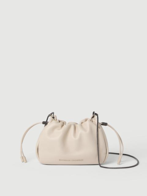 Mellow mini bucket bag in soft leather with precious chain