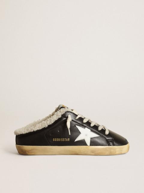 Super-Star Sabots in black nappa leather with white leather star and beige shearling lining