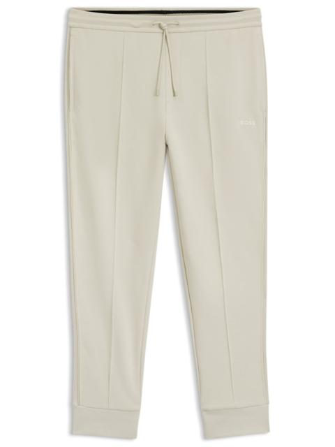 PIPING-DETAIL TRACKSUIT BOTTOMS IN A COTTON BLEND