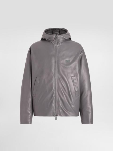 Padded leather jacket with hood and tag