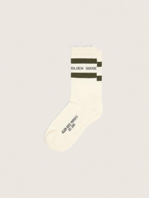 Cotton socks with distressed finishes, green stripes and black logo