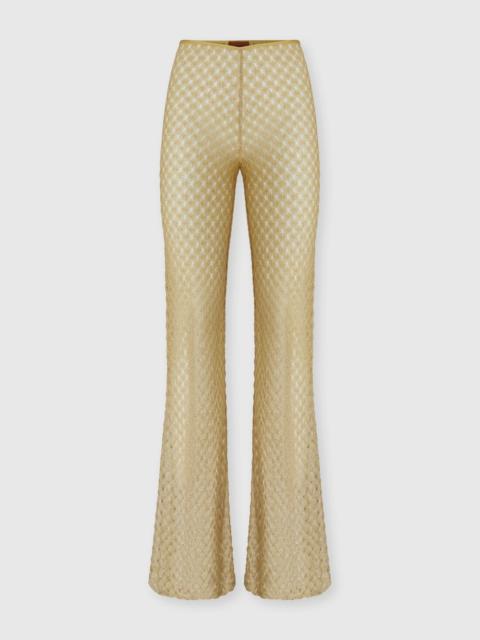 Flared trousers in lamé viscose with raschel workmanship