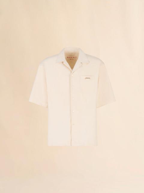 CREAM DENIM SHIRT WITH TRUNAKAROO PLAQUE