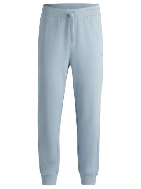 COTTON-TERRY TRACKSUIT BOTTOMS WITH LOGO PRINT