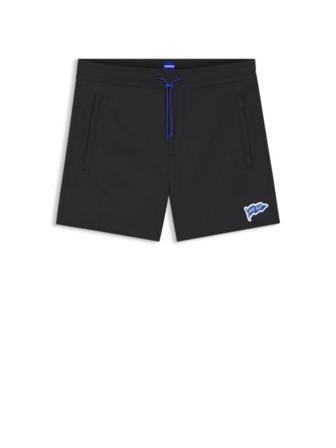 WATER-REPELLENT SHORTS WITH FLAG LOGO