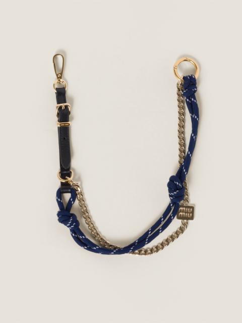 Leather, cord and metal trick