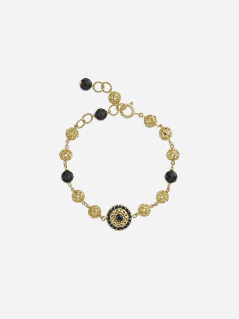Gold bracelet with black sapphires