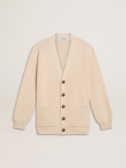 Women’s beige cardigan with 'Golden' lettering on the back