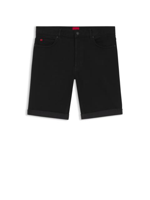 TAPERED-FIT SHORTS IN BLACK STRETCH DENIM