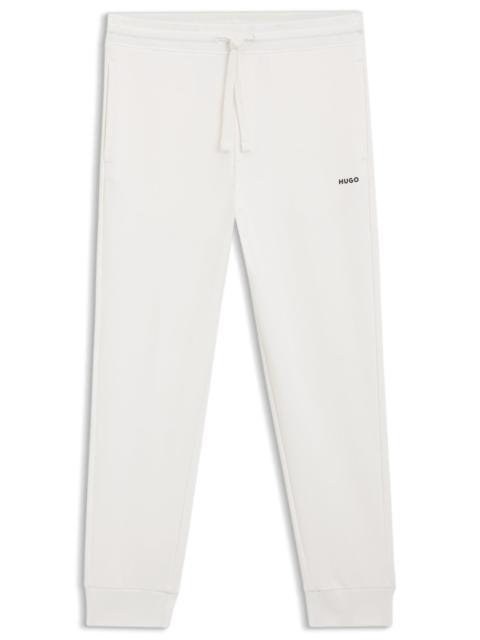 CUFFED SWEATPANTS IN COTTON TERRY WITH LOGO PRINT