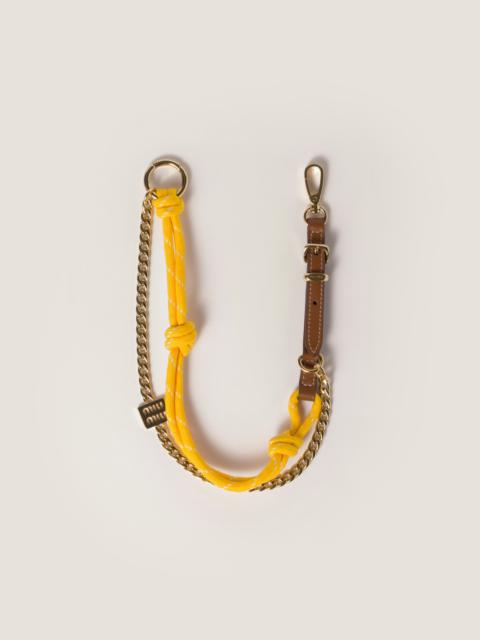 Leather, cord, and metal trick