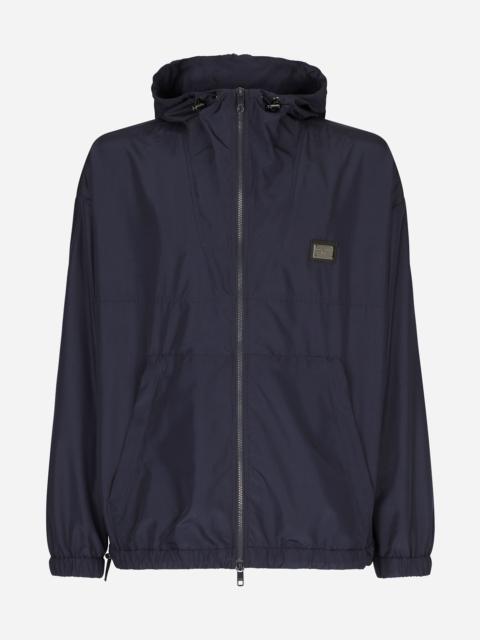 Nylon jacket with hood and branded tag