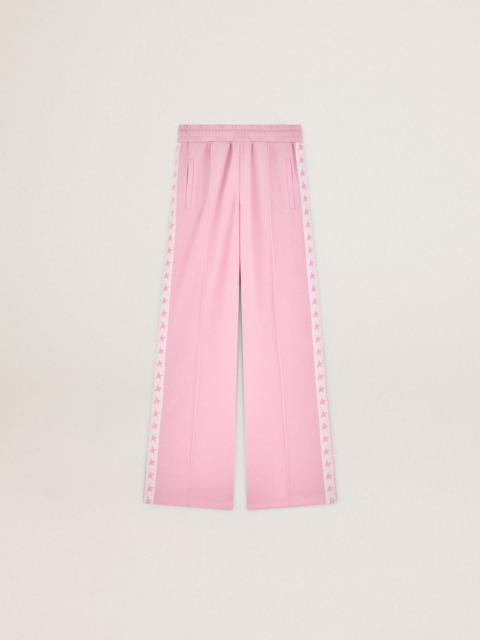Women's pink joggers with band and stars on the sides