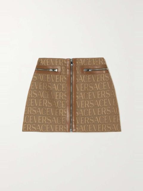 Leather-trimmed canvas-jacquard mini skirt