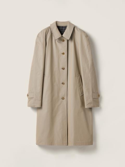 Reversible twill and check trench coat