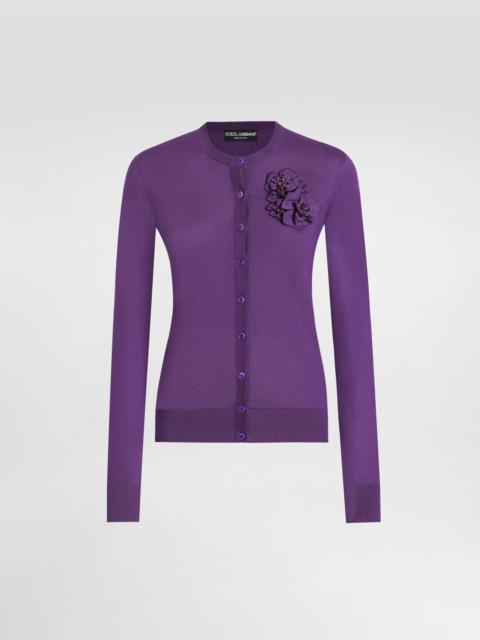 Silk cardigan with flower brooch