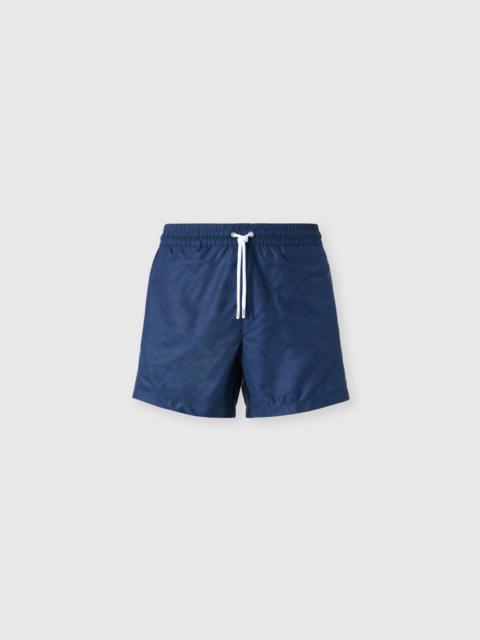 Mid-length swim shorts with tone-on-tone zigzag print