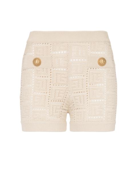 Monogrammed openwork knit mini shorts