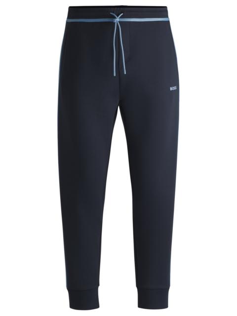 TRACKSUIT BOTTOMS WITH TAPE AND LOGO