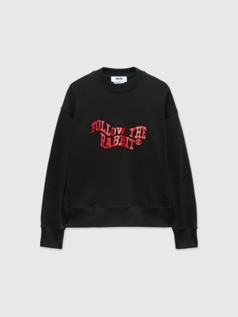 Black jersey sweatshirt with "Follow the Rabbit®" quote