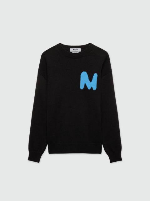 Black cashmere blend sweater with "TheMwave" patch