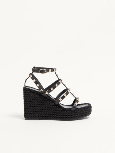 ROCKSTUD ANKLE STRAP WEDGE SANDAL IN CALFSKIN LEATHER 95 MM