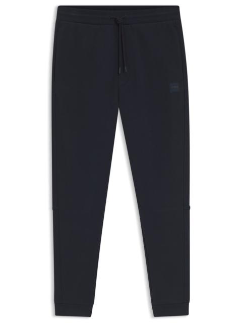 COTTON-TERRY TRACKSUIT BOTTOMS WITH LOGO PATCH