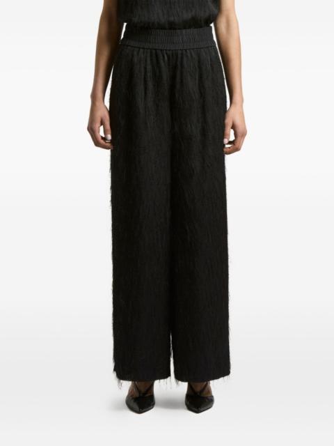 elastic-waist fringed-hem trousers