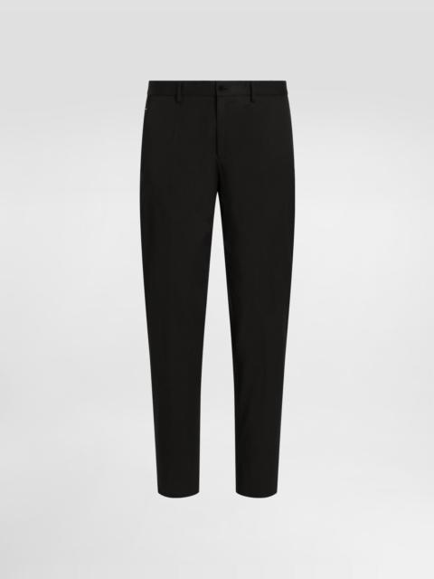 Stretch cotton pants with branded tag