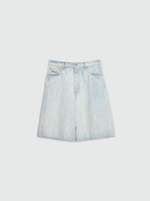 Bermuda shorts in light denim with a destroyed effect