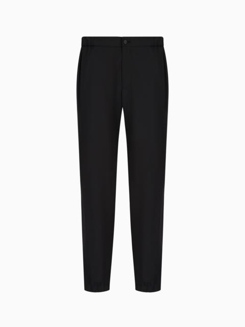 Natural stretch canvas trousers with elasticated cuffs